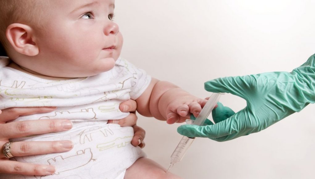 Baby was receiving his scheduled vaccine injection in his right